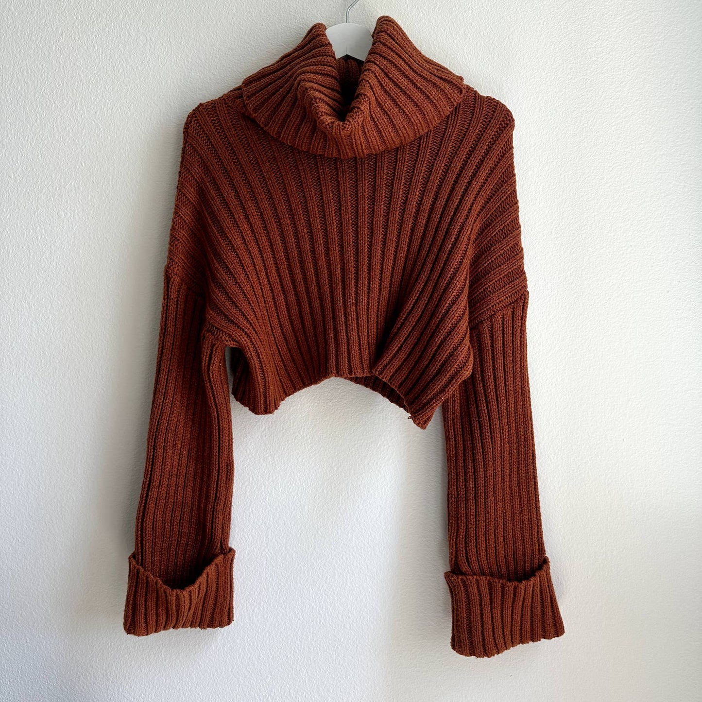 Oversized rust orange ribbed knit turtleneck cropped bell sleeve sweater